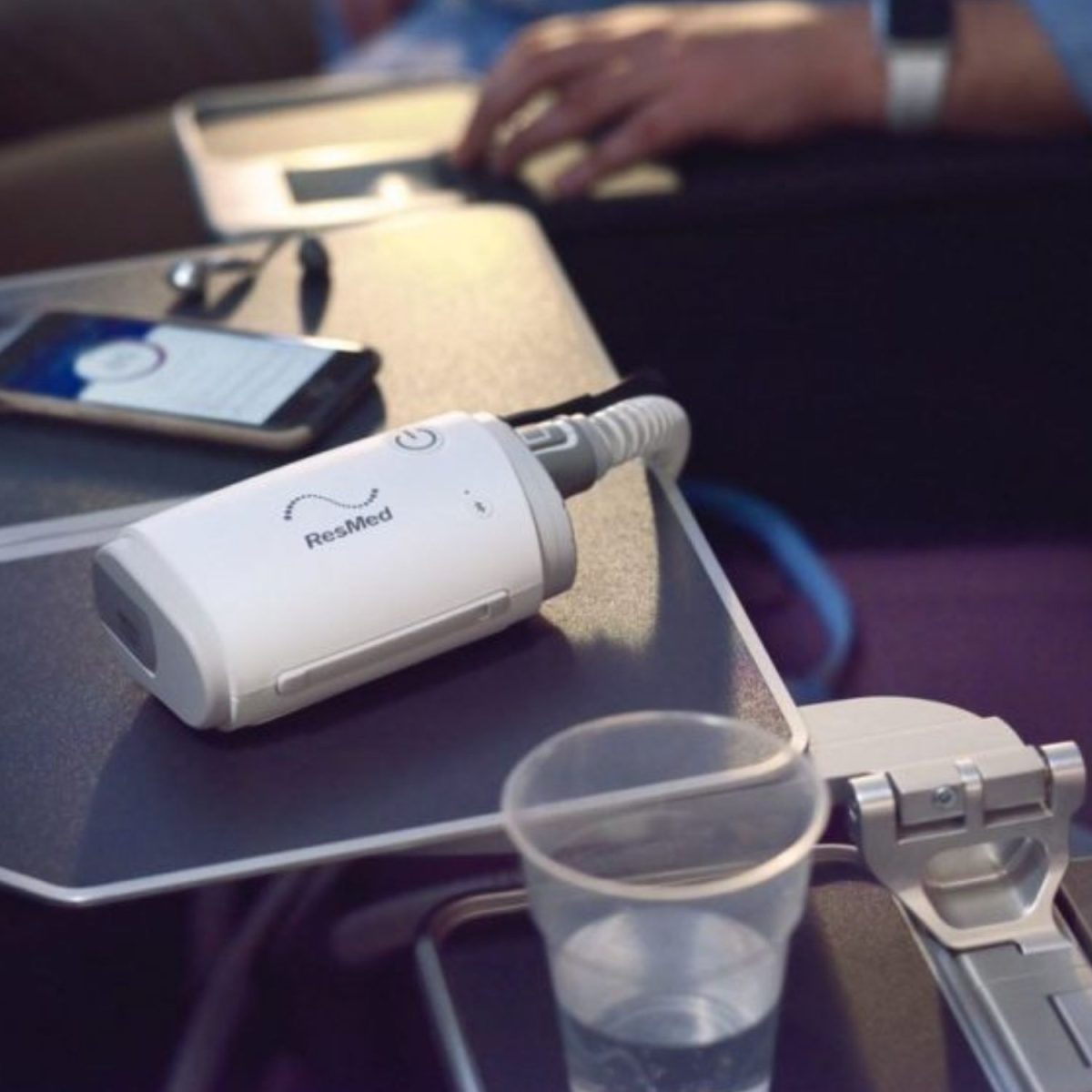 AirMini Travel CPAP Machine being used on a plane | Intus Healthcare