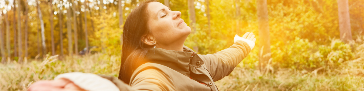 women breathing in nature