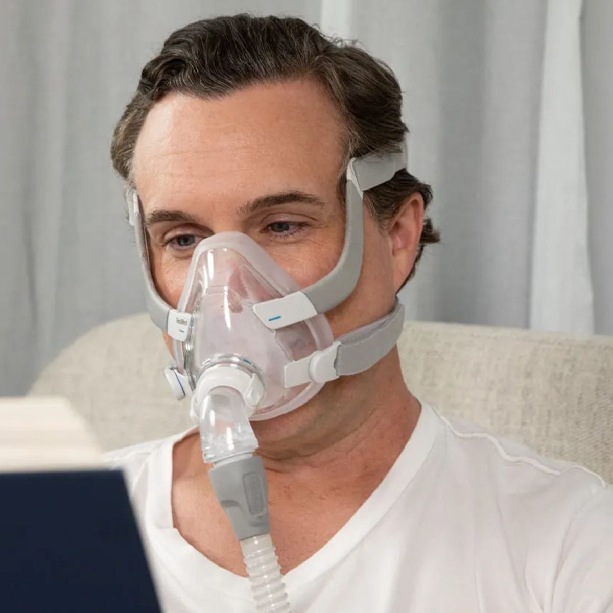 ResMed AirFit F20 CPAP Mask being worn in bed | Intus Healthcare